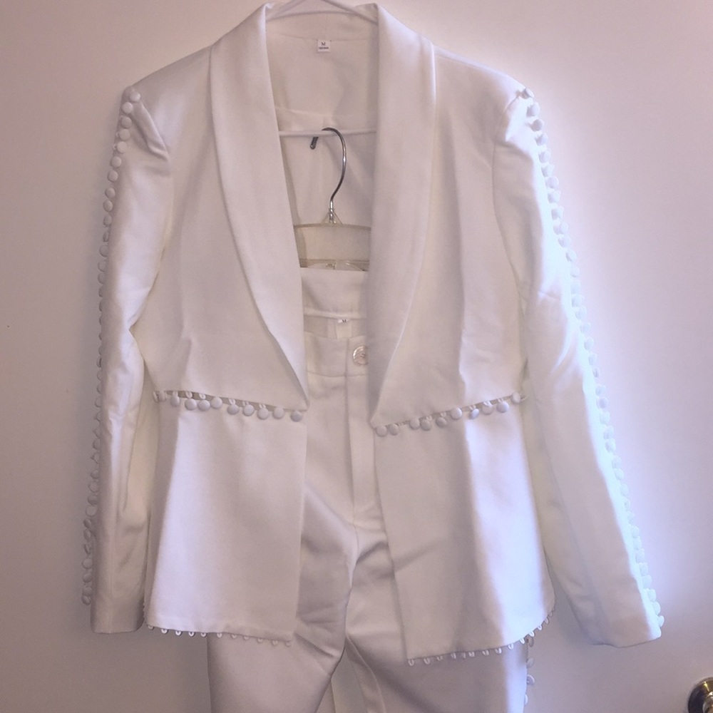 Two piece suit with button accents